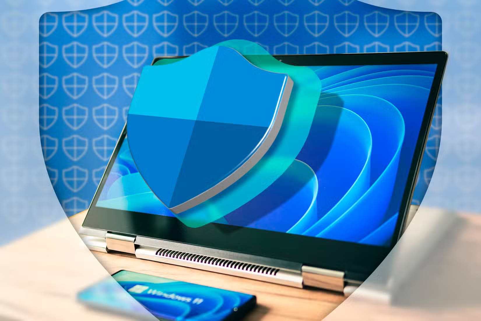 a-laptop-with-windows-11-and-the-windows-defender-logo-in-front-of-the-screen-1 خطوات بسيطة للتعامل مع الفيروسات المكتشفة بواسطة أمان Windows