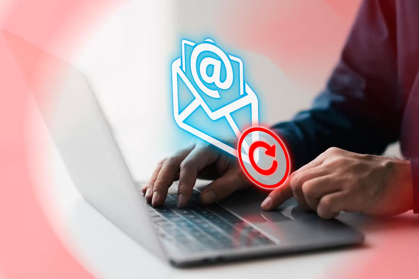 a-man-using-a-laptop-with-an-email-icon-and-a-refresh-symbol أخطاء شائعة في Gmail قد تعرض وظيفتك للخطر وكيف تتجنبها