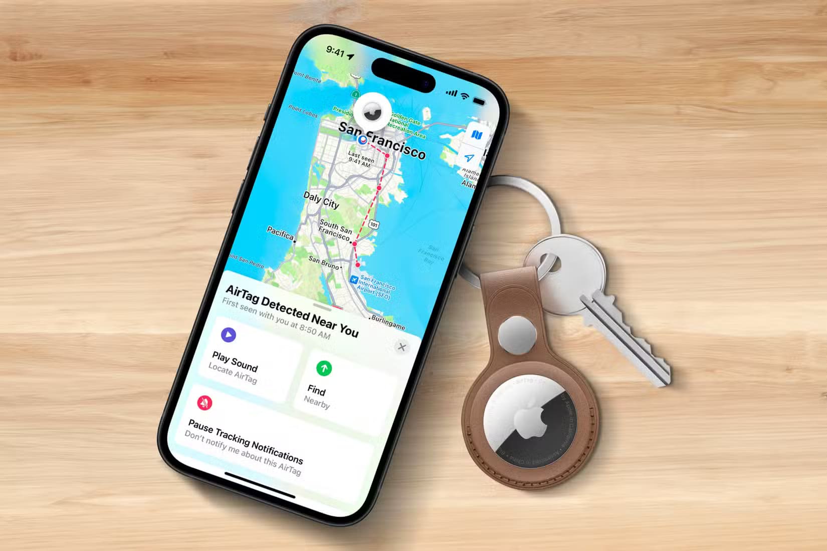 apple-iphone-find-my-app-airtag-key-ring-wooden-surface-1 علامات تدل على ضرورة تغيير خطة مشاركة العائلة من Apple