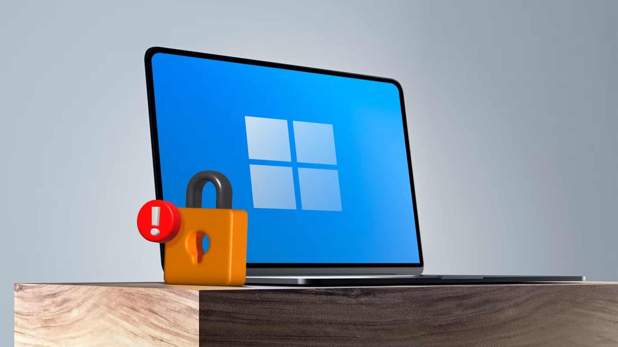 a-windows-laptop-with-a-lock-and-a-warning-sign-next-to-it-scaled طرق فعالة لحماية الكمبيوتر المحمول من السرقة والمخاطر أثناء السفر