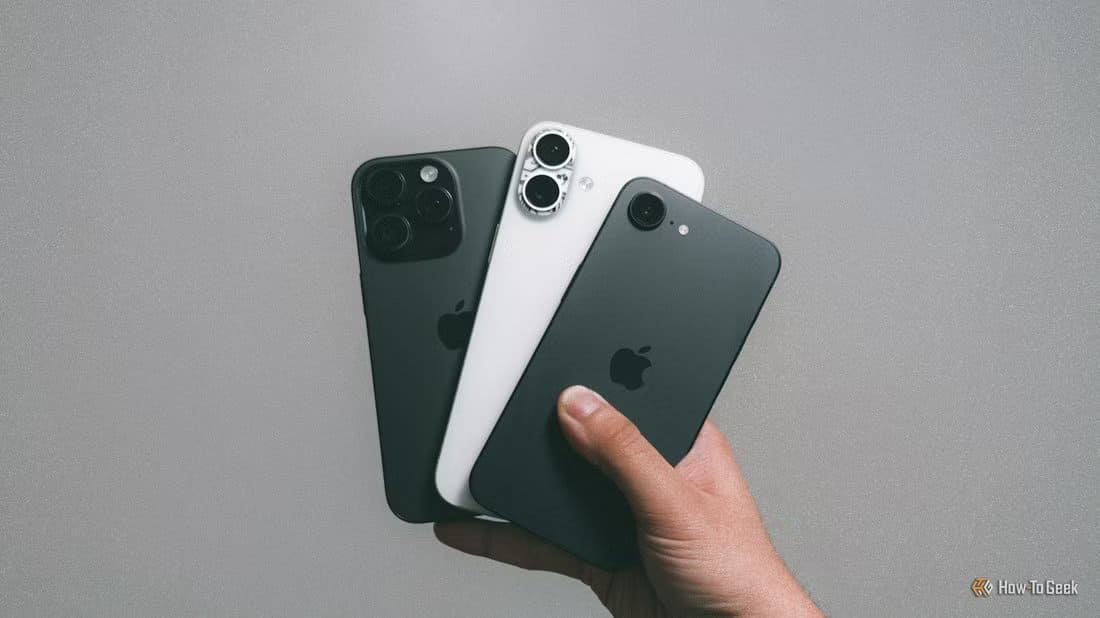 iphone-16e-with-iphone-16-plus-and-iphone-16-pro-in-hand-against-grey-wall-1 أفضل 8 تطبيقات مجانية لمتابعة الميزانية اليومية على iPhone
