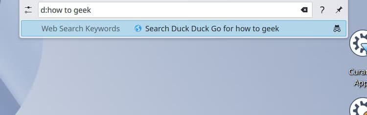 krunner-launcher-menu-with-a-duckduckgo-search-for-the-term-how-to-geek-in-the-results ميزات في KDE Plasma تعزز إنتاجيتك وتمنحك تحكمًا أوسع في Linux