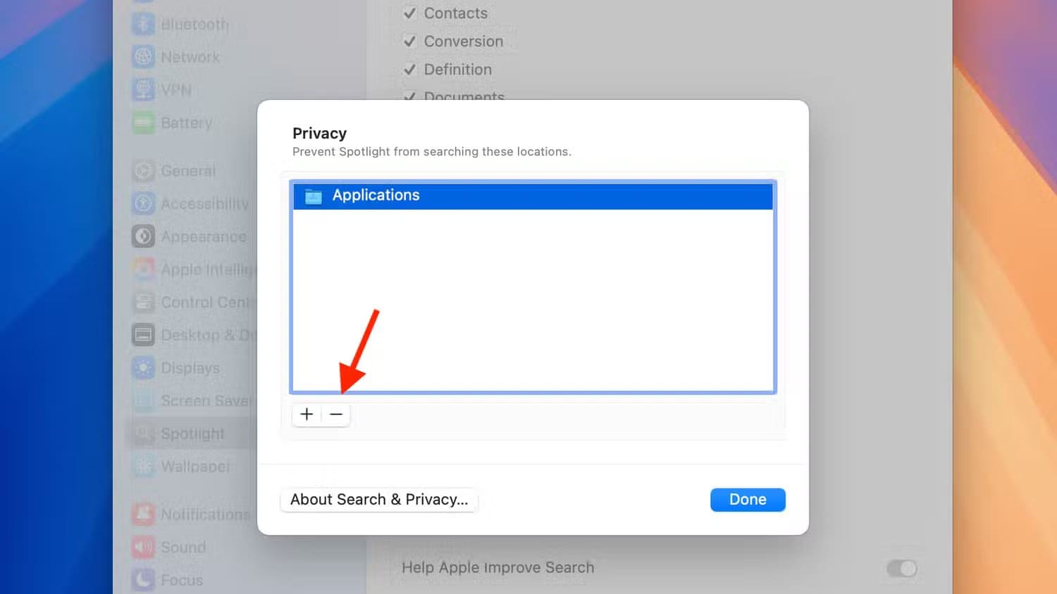 minus-icon-for-privacy-in-spotlight-settings-on-mac حل مشكلة اختفاء التطبيقات من Spotlight في Mac