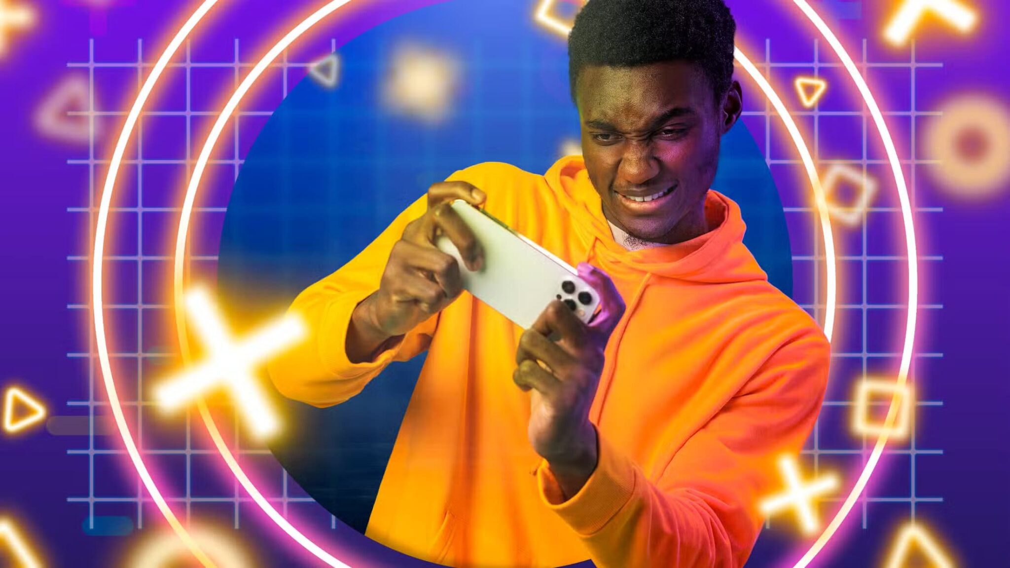 a-guy-gaming-on-his-smartphone-with-game-related-icons-around-him-scaled أفضل ألعاب جماعية ممتعة يمكنك لعبها مع أصدقائك بالهاتف فقط