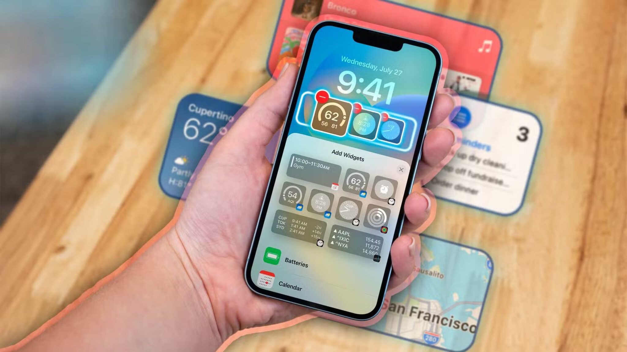 a-hand-holding-an-iphone-with-some-widgets-on-the-screen-scaled أهم الأشياء التي يجب معرفتها قبل استخدام أدوات iPhone لأول مرة