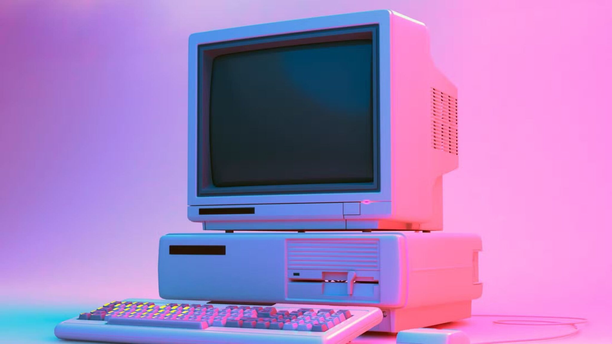 vintage-desktop-pc-with-floppy-drive-keyboard-and-mouse-in-neon-lightning-scaled أسباب تجعل الإنترنت عبر الهاتف لا غنى عنه حتى اليوم