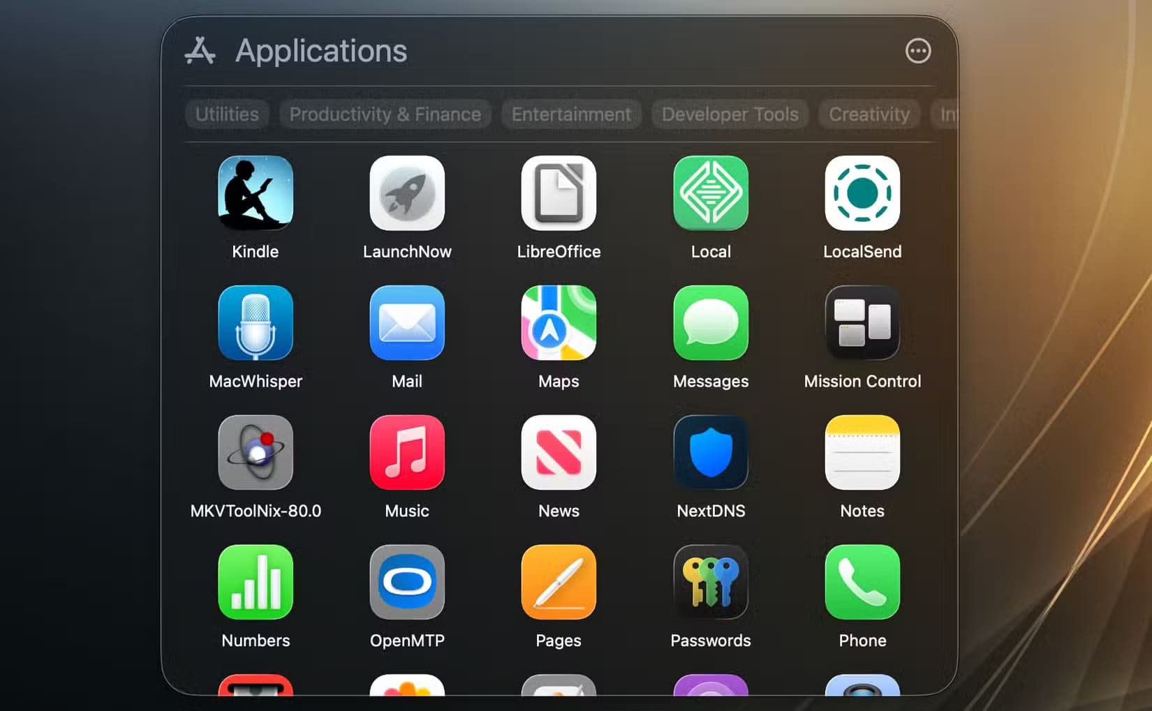 the-applications-view-in-spotlight طرق استبدال لوحة التشغيل في macOS Tahoe بسهولة