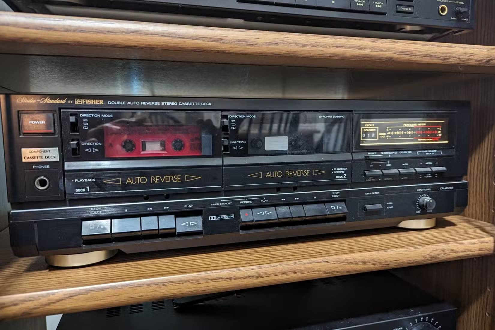 a-fisher-cr-w780-cassette-tape-deck-in-an-audio-cabinet لماذا تتلف أشرطة الكاسيت القديمة وكيف تحافظ عليها من التدهور