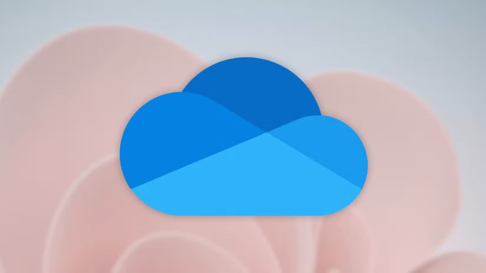 microsoft-onedrive-logo-over-flower طرق فعالة لعمل نسخة احتياطية في Windows تحمي ملفاتك من الفقدان
