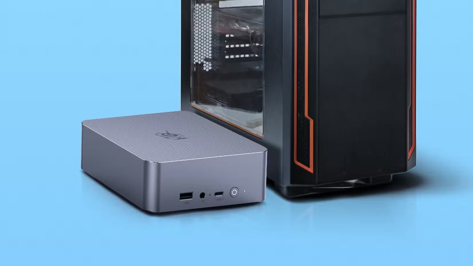 a-mini-pc-placed-beside-a-large-desktop-tower-case-both-set-against-a-blue-background طرق ذكية لاستفادة قصوى من جهاز الكمبيوتر الصغير القديم وزيادة أدائه دون استبداله