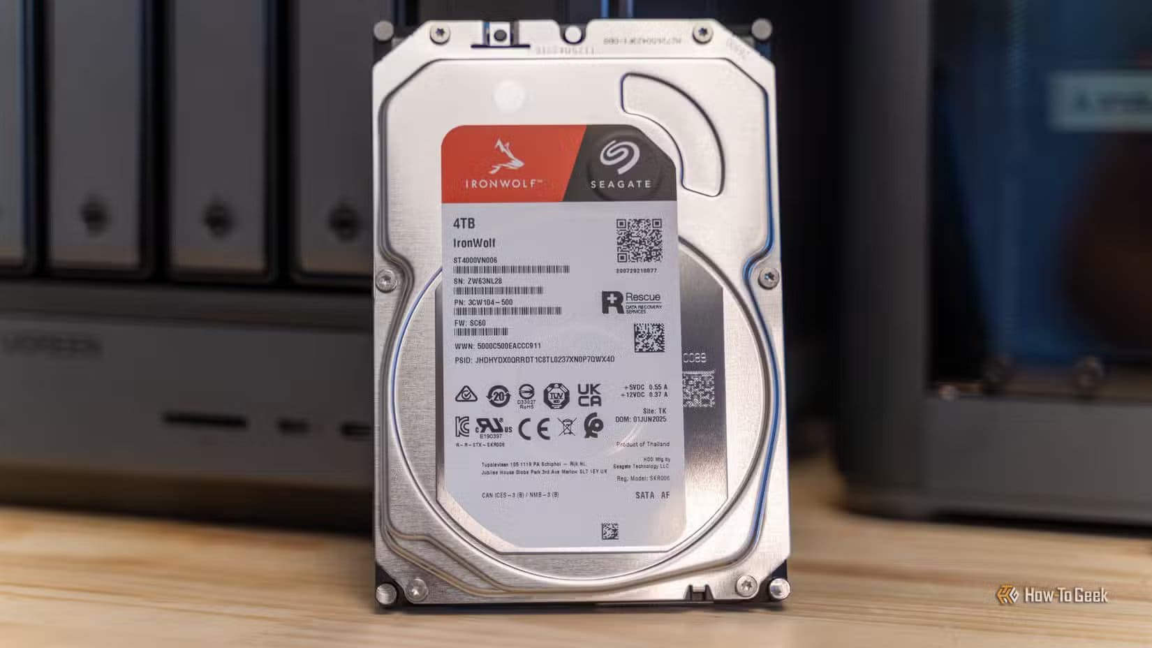 a-seagate-ironwolf-4tb-hard-drive-label-shown-up-close-in-front-of-the-ugreen-idx6011-pro-nas لماذا تعتبر فتحات M.2 الخيار الأهم عند اختيار وحدة التخزين في تجميع الكمبيوتر