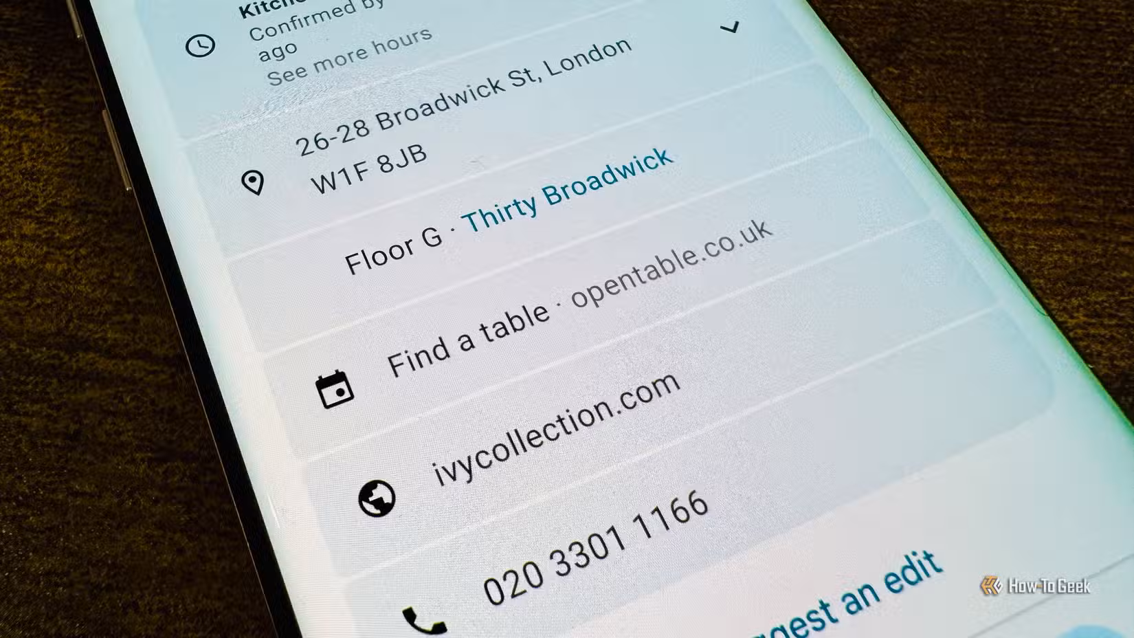 photo-of-a-phone-showing-a-google-maps-listing-for-the-ivy-collection-restaurant-with-find-a-table-link-to-opentable 5 تطبيقات تعمل مع خرائط جوجل لتسهيل التنقل والسفر