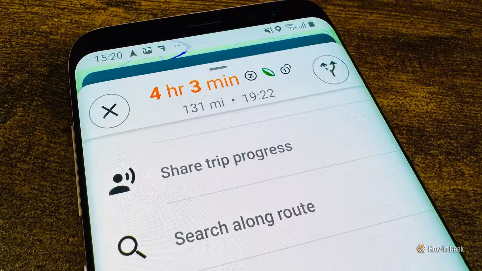 photo-of-a-phone-showing-the-google-maps-trip-progress-card-photo-1-of-2-with-share-trip-progress-and-search-along-route-options 5 تطبيقات تعمل مع خرائط جوجل لتسهيل التنقل والسفر
